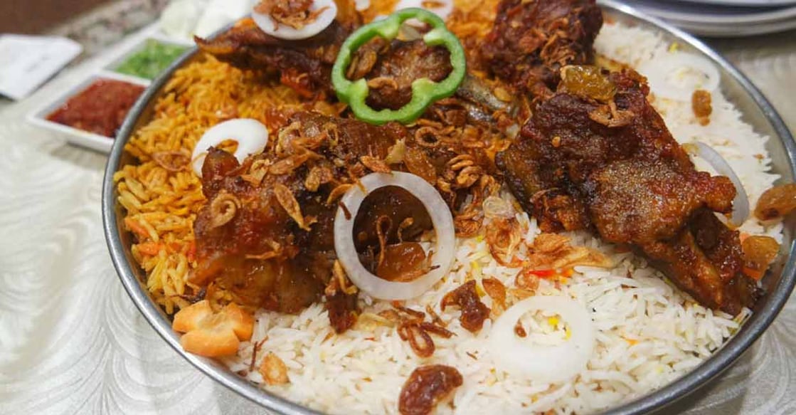 mandi To prepare mandi, rice is slow-cooked in the marinated meat stock immersed in a clay pit. Photo: Shutterstock/msalbarid93