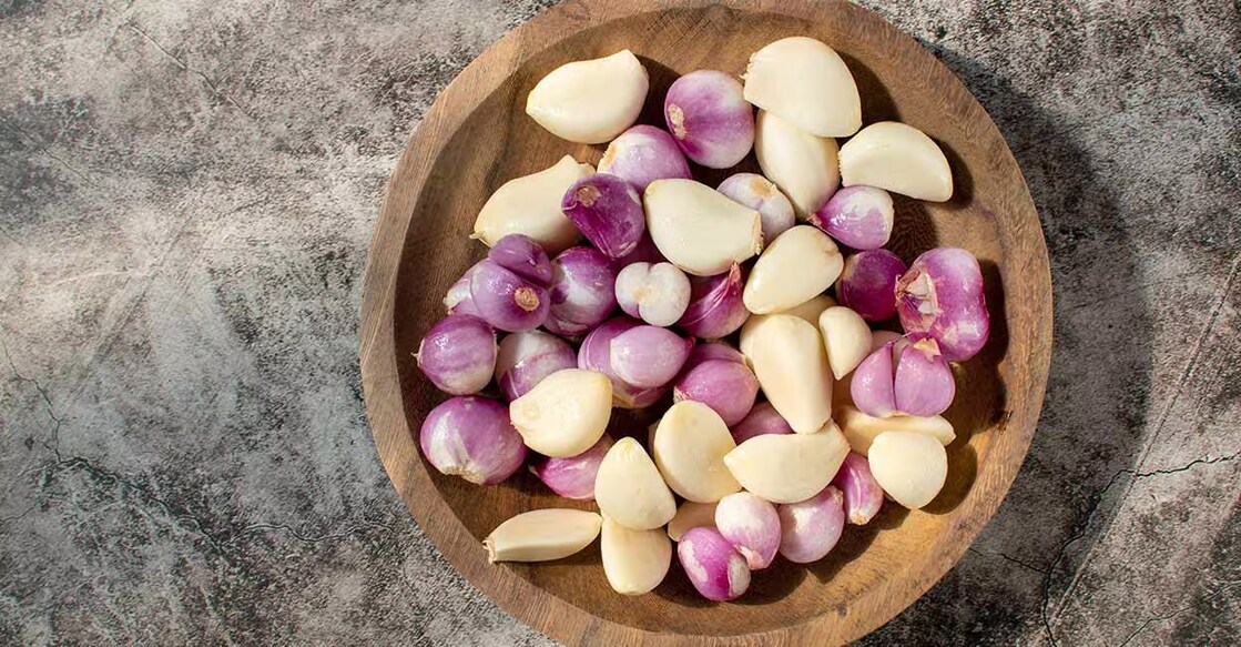 While shallots are added raw in our buttermilk, aka sambharam, pachadi, as ring toppings in various dishes and in chutneys, raw garlic is also added in various pickles, fish fries and curries, pachadies and salads. Photo: Herman Suparman/Shutterstock.com
