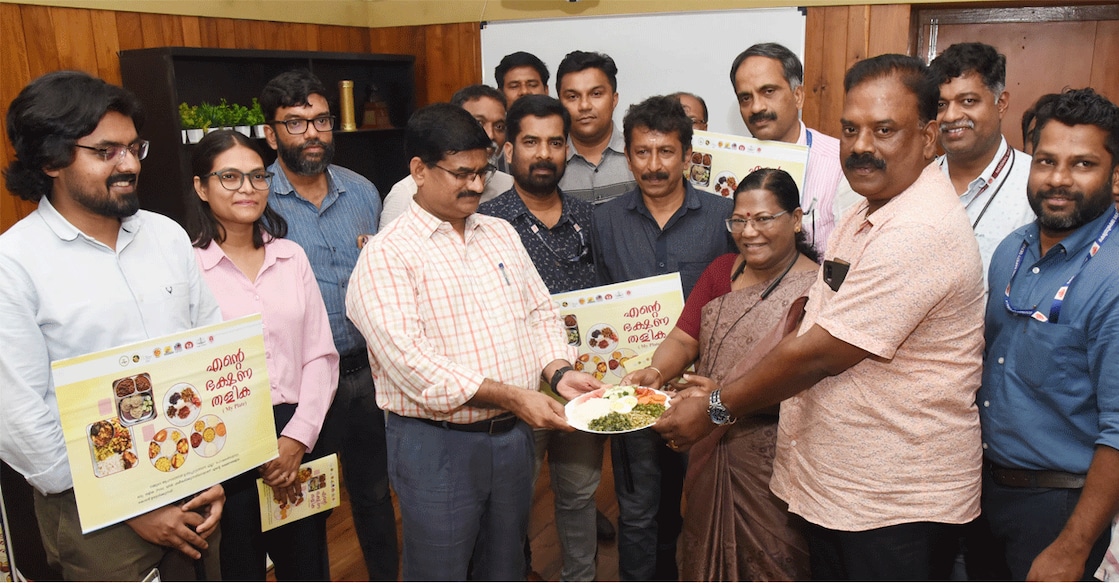 healthy-plate Malappuram district collector V R Vinod, DMO Dr M Renuka and the Food Safety Officer Sujith Pereira with the health plate in the collector's chamber. Photo: Special Arrangement