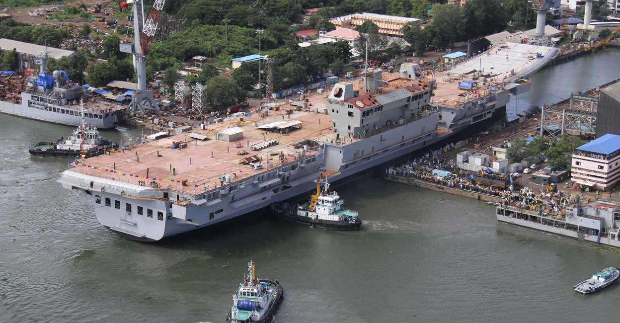 Indigenously built INS Vikrant docks at Cochin shipyard after the completion of her structural works there. Photo: Handout picture from India Navy / EV Sreekumar