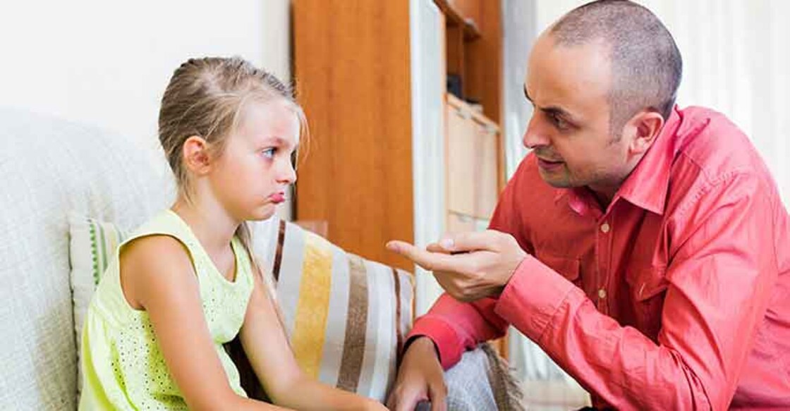 Dad giving instructions to child