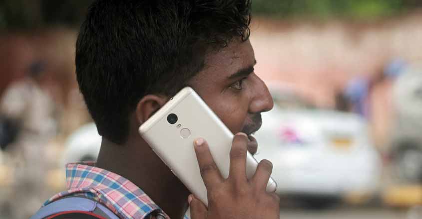 A man talks over cell phone. (File Photo: IANS)