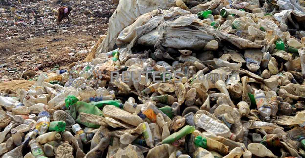 A woman collects plastic bottles for recycling at the garbage dump on the outskirts of Agartala, Tripura. Photo: Photo: Reuters/Jayanta Dey