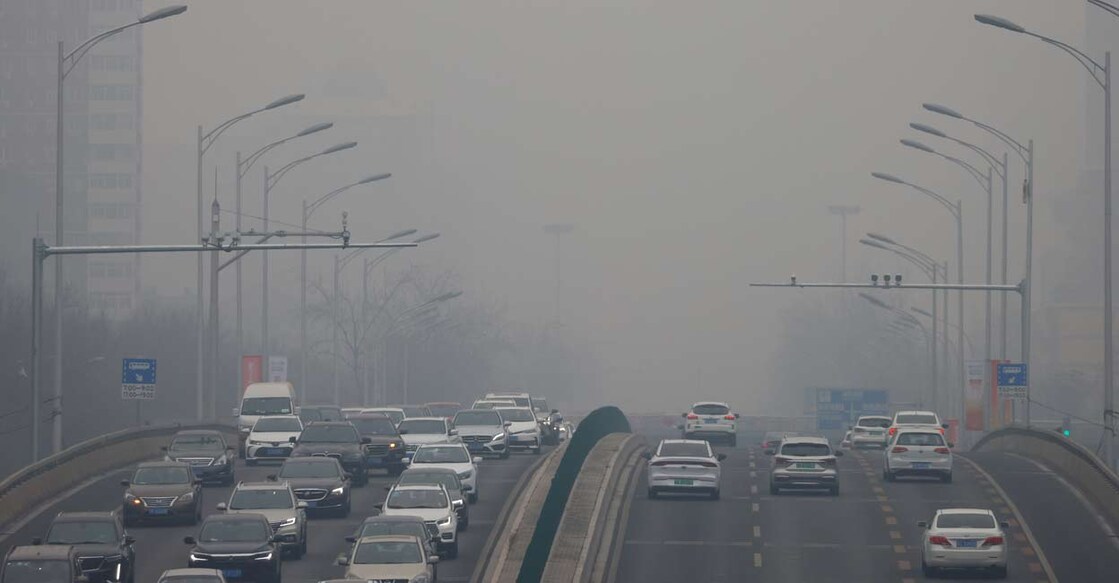 Cars move on a road during a day with polluted air, following the outbreak of the coronavirus disease, in Beijing, China. Photo: REUTERS/Carlos Garcia Rawlins/File