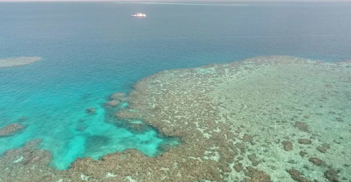 AUSTRALIA-CLOUD-BRIGHTENING A general view of Broadhurst Reef and a research vessel during the second field trial at Broadhurst Reef on the Great Barrier Reef, Queensland, Australia (file photo). Image courtesy: Handout via Reuters