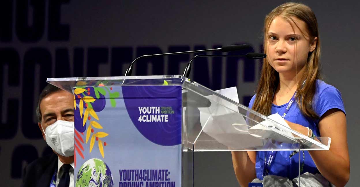 Swedish climate activist Greta Thunberg looks on as she speaks during the Youth4Climate pre-COP26 conference in Milan, Italy. REUTERS/Flavio Lo Scalzo
