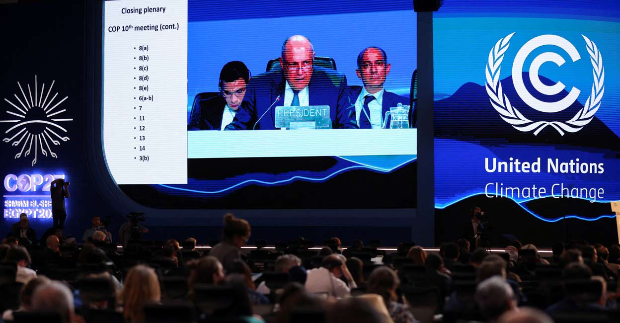 A screen shows COP27 President Sameh Shoukry delivering a statement during the closing plenary at the COP27 climate summit in Red Sea resort of Sharm el-Sheikh, Egypt.  Photo: Reuters/Mohamed Abd El Ghany