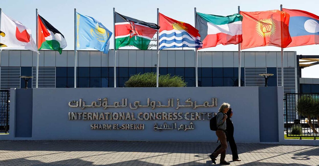 CLIMATE-UN-COP27-OPENING Participants walk outside of the Sharm El Sheikh International Convention Centre before the COP27 climate summit opening in Egypt's Red Sea resort of Sharm el-Sheikh, Egypt. Photo: Reuters/Thaier Al-Sudani
