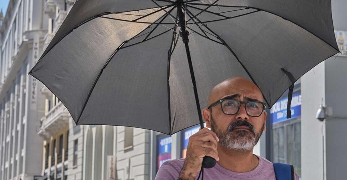 A man holds an umbrella during a heatwave in Madrid, Spain, on July 20, 2022. (Xinhua/Meng Dingbo/IANS) Representative image. Photo: IANS