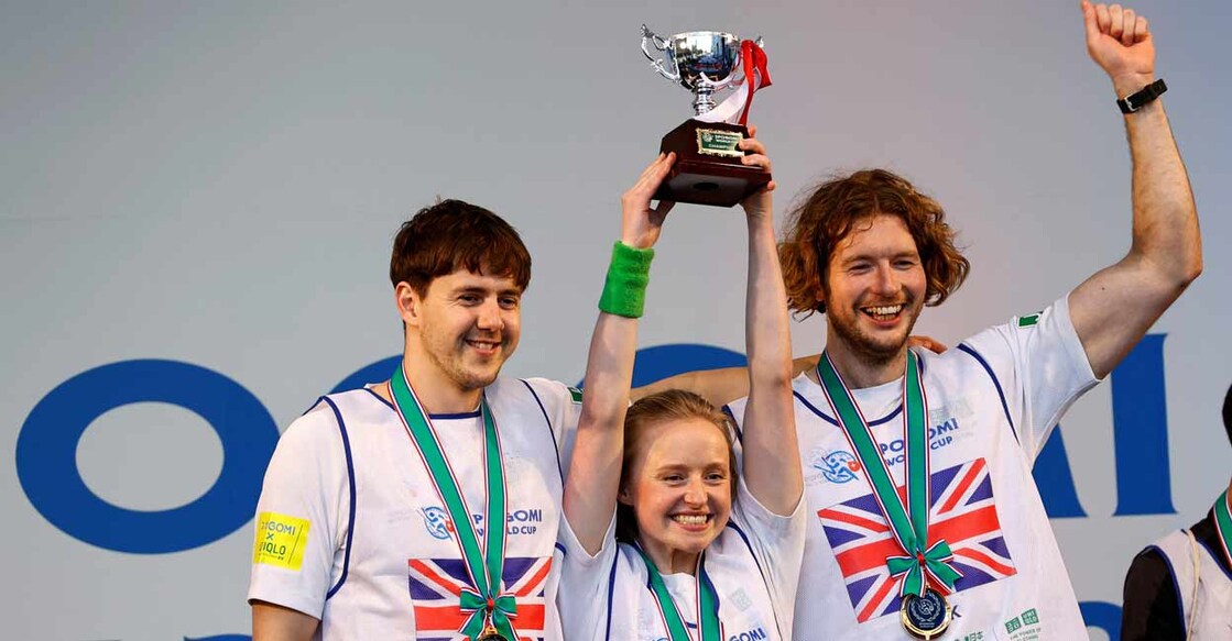 Members of team UK pose with their victory trophy at an award ceremony during a trash picking competition known as 'Spogomi World Cup' in Tokyo. Photo: Reuters/Kim Kyung-Hoon