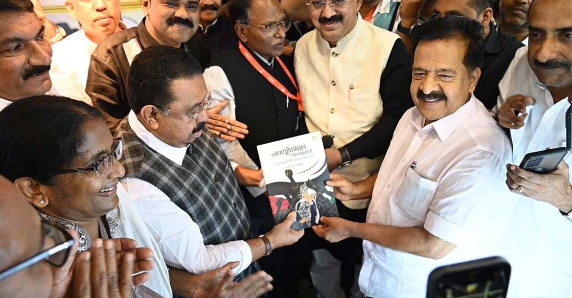 Chennithala releasing the Malayalam book titled 'Palestinile Nilavilikal: Paschimeshyan Velluvilikal' by handing over a copy to United Democratic Front convenor M M Hassan. Photo: Special arrangement