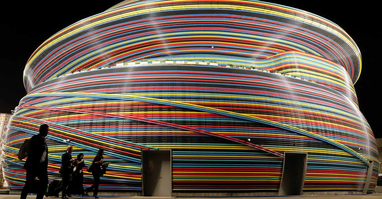 Delegates walk in front of the Russia Pavillion building at Dubai's Expo City during the United Nations Climate Change Conference (COP28) in Dubai on December 6. Photo: Reuters/Thomas Mukoya/File