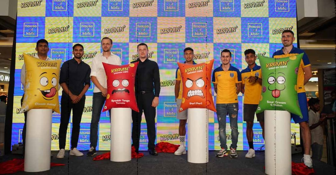 kerala-blasters-kravin Kerala Blasters FC head coach Ivan Vukomanovic and players, Sahal Abdul Samad, KP Rahul, Adrian Luna and Ivan Kaliuzhnyi during the launch of House of KBFC’s Kravin banana chips. Nikhil Bharadwaj, Club Director, Karolis Skinkys, Sporting Director, and Mohit, CFO also attended the launch. Photo: Kerala Blasters
