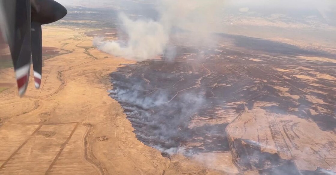 An aerial view shows wildfire smoke in Lahaina, Hawaii, U.S., in this screen grab obtained from a social media video. Lieutenant Governor Sylvia Luke via Facebook/via Reuters
