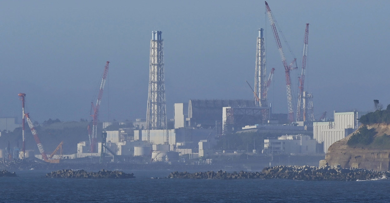 The tsunami-crippled Fukushima Daiichi nuclear power plant is seen from Namie Town, Fukushima prefecture, Japan August 24, 2023, in this photo taken by Kyodo. Kyodo/via REUTERS
