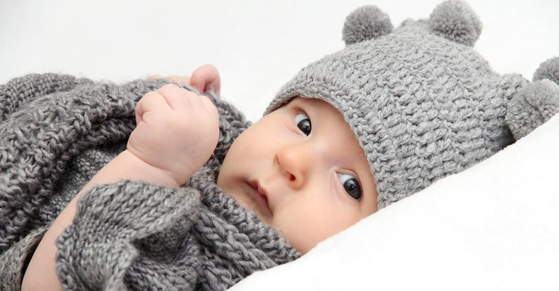 The baby won't stay warm or safe with more layers of clothing, but they will with the appropriate winter wardrobe. Representative image: NikolayK/iStock