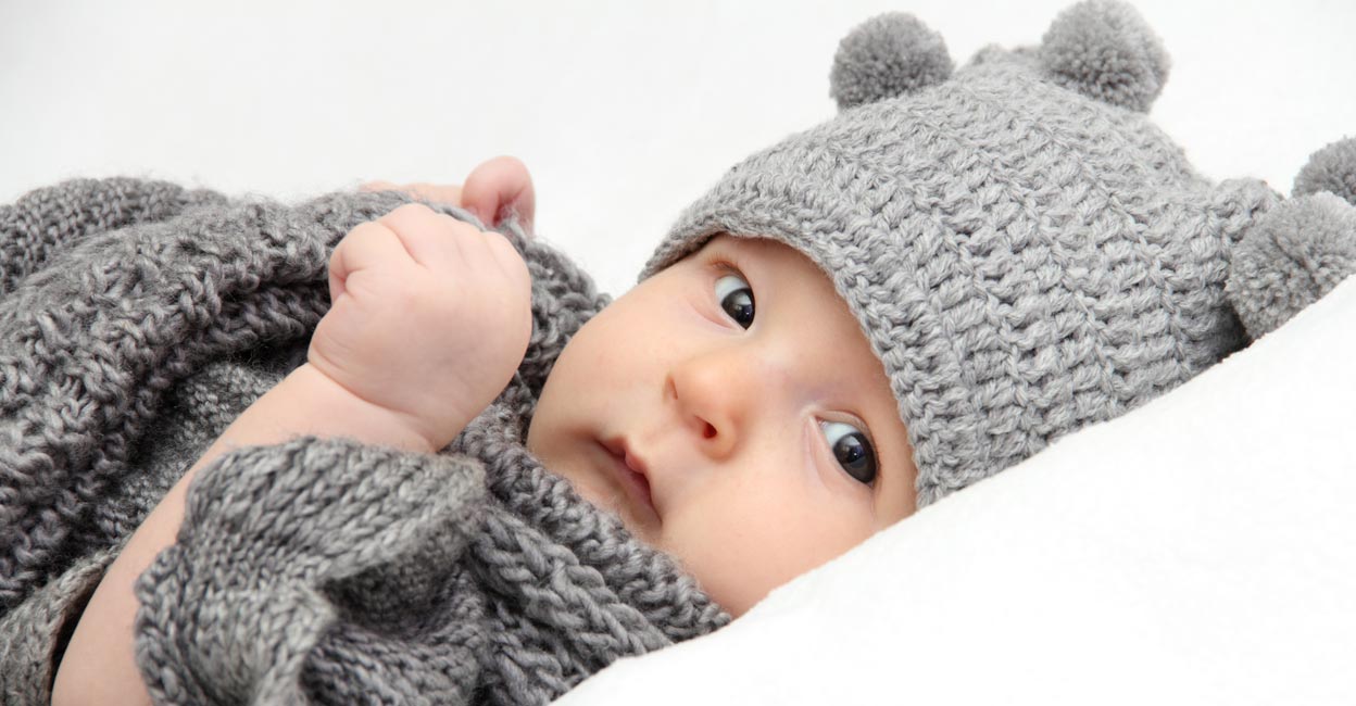 The baby won't stay warm or safe with more layers of clothing, but they will with the appropriate winter wardrobe. Representative image: NikolayK/iStock