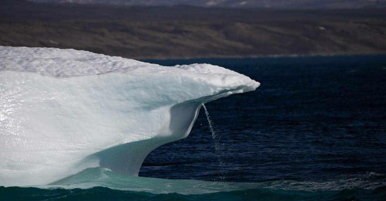 A photograph taken in Scoresby Fjord, Estarn, shows an iceberg melting. Photo: Olivier MORIN/AFP/File