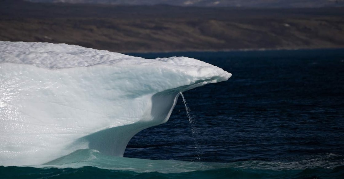 ARCTIC-ENVIRONMENT-CLIMATE-GREENLAND A photograph taken in Scoresby Fjord, Estarn, shows an iceberg melting. Photo: Olivier MORIN/AFP/File
