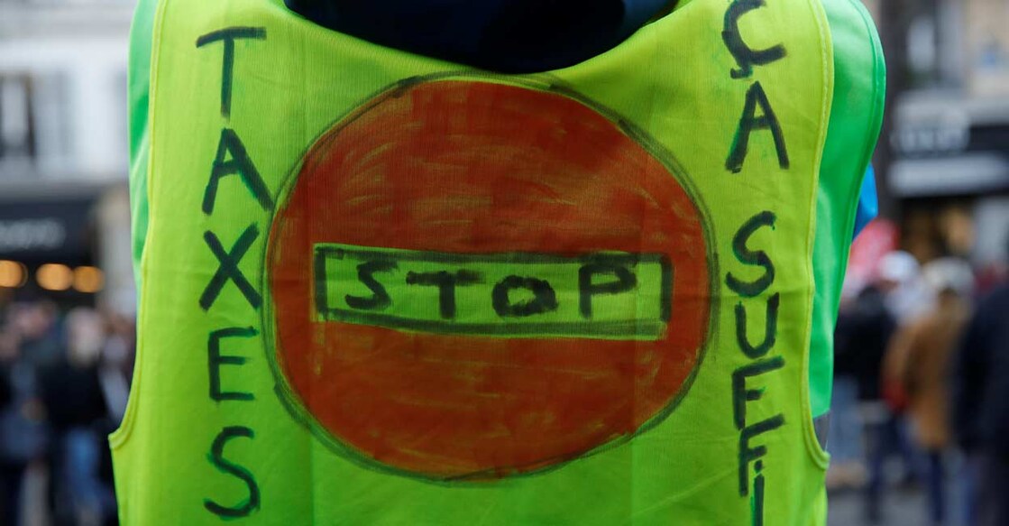 FRANCE-PROTESTS A protester wears a yellow vest at a CGT labour union demonstration to protest against the French government's reforms in Paris. Photo: Reuters/Gonzalo Fuentes