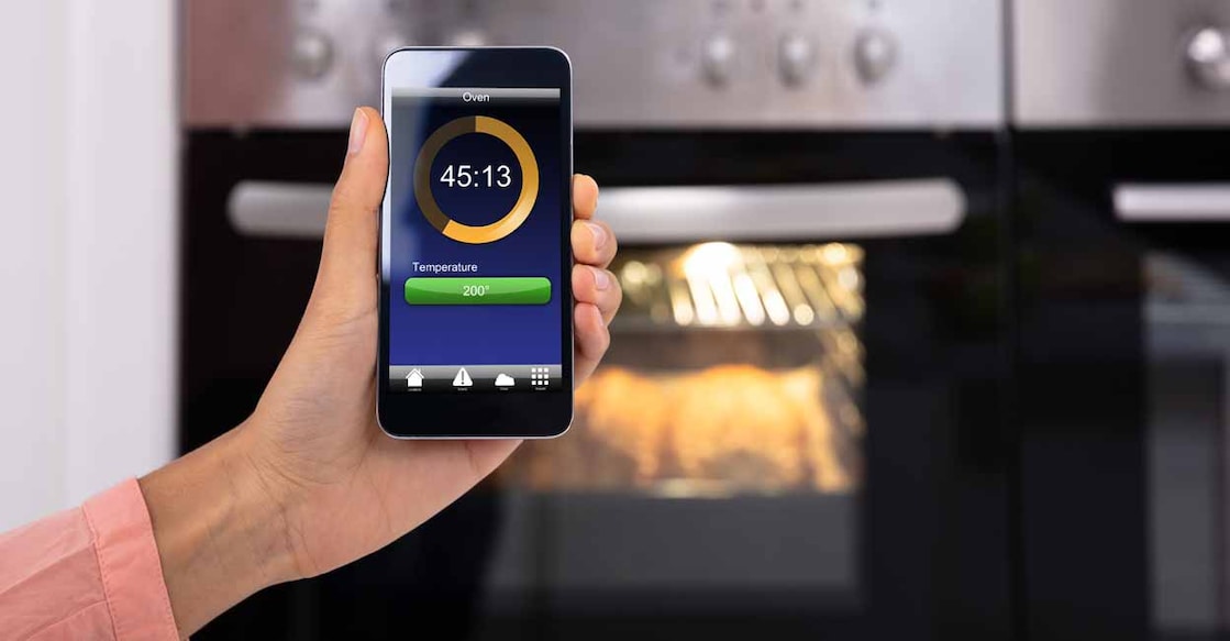 The cutting-edge technology allows you to control the oven remotely using your smartphone. AndreyPopov/iStock