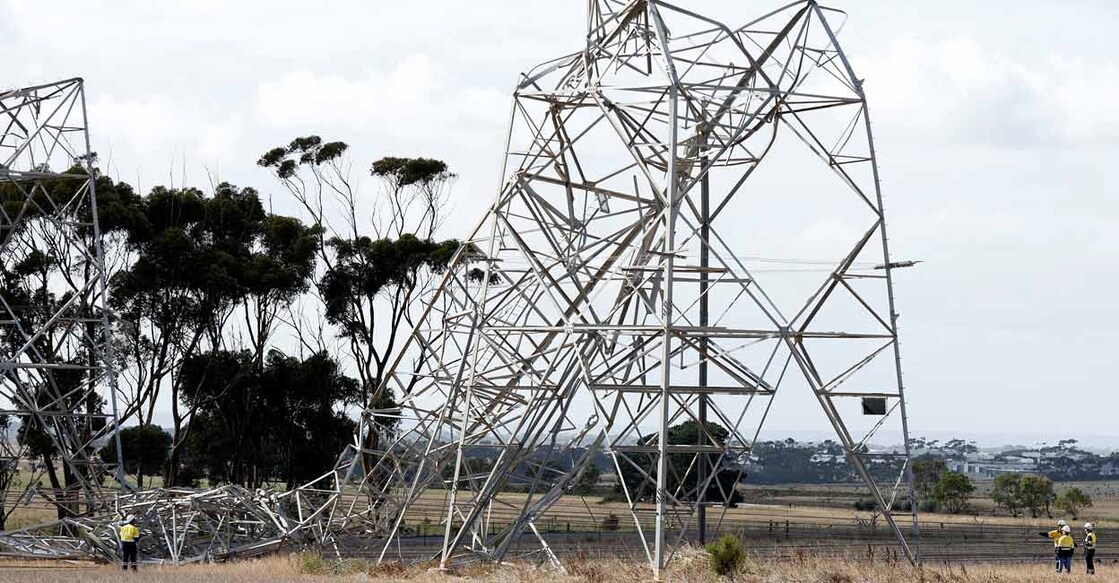 Workers inspect damaged transmission towers at Anakie in Victoria, Australia Wednesday. Photo courtesy: AAP Image/Con Chronis via Reuters