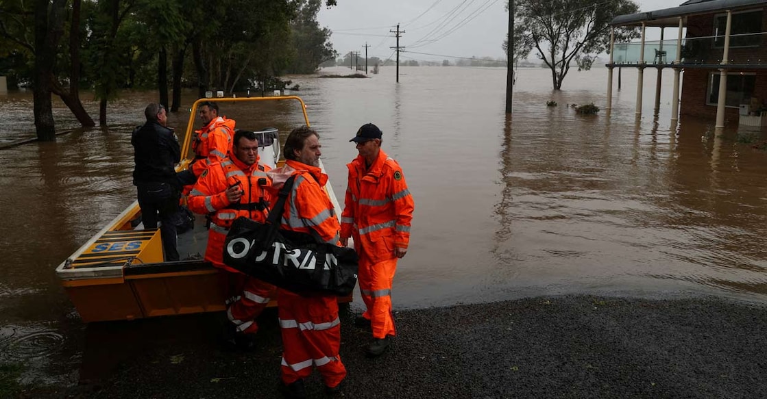 State Emergency Service (SES) personnel prepare to deploy as floodwaters submerge residential areas following heavy rains in the Windsor suburb of Sydney, Australia. Photo: Reuters/Loren Elliott/Photo