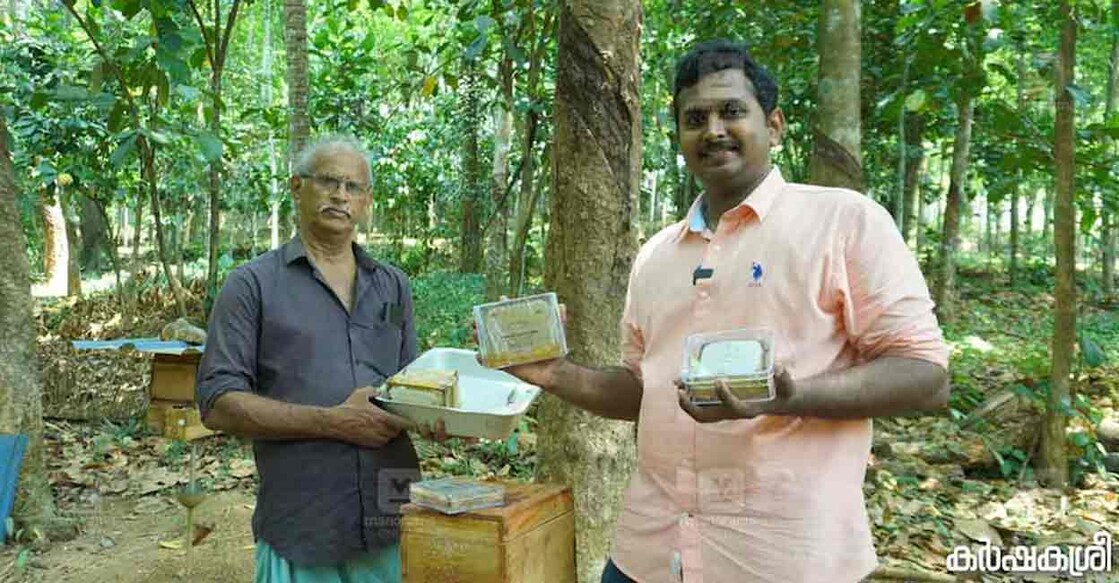 Anoop Baby Sam with his father Baby at their apiary. Photo: Special arrangement