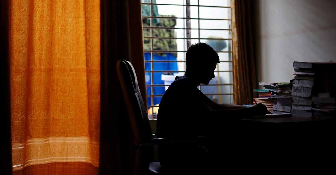 Sheikh Tamim Hasan, a student of class seven, studies in his room as authorities decided to close schools during countrywide heatwave in Dhaka, Bangladesh. Photo: Reuters/Mohammad Ponir Hossain