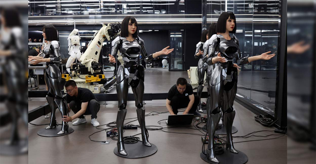 Employees work on humanoid robots at the office of developer Ex-Robots in Dalian, Liaoning province, China. Photo: Reuters/Florence Lo/File