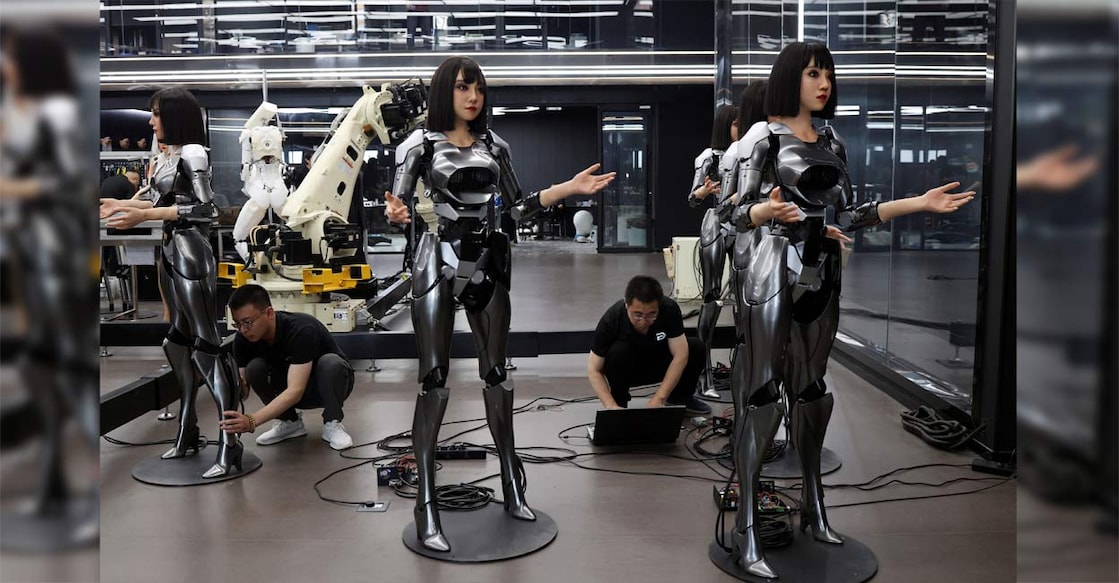 CHINA-ROBOT Employees work on humanoid robots at the office of developer Ex-Robots in Dalian, Liaoning province, China. Photo: Reuters/Florence Lo/File