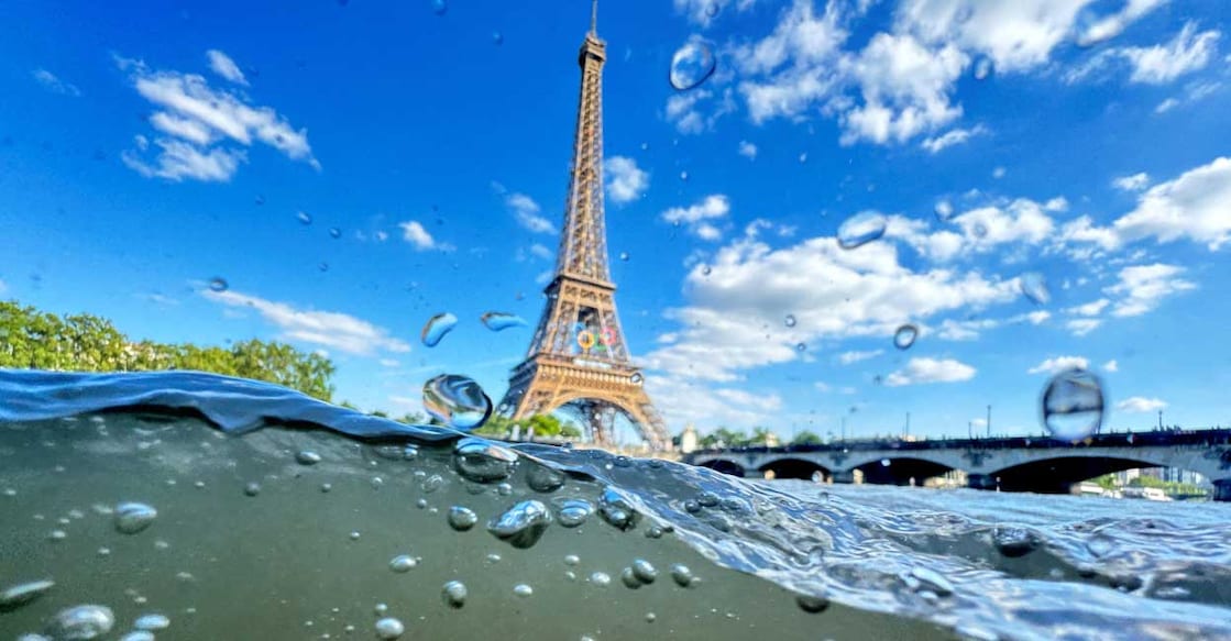 OLYMPICS-2024-SEINE The Eiffel Tower is seen from the water of the Seine River as the Olympics opening ceremony rehearsal is postponed amid rainy weather. Photo: Reuters/Pawel Kopczynski/File