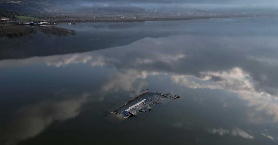 CLIMATE-CHANGE-WORLD-COURT A livestock farm is almost entirely submerged by floodwater, following the extreme flooding of last September, in the village of Kanalia, Greece. Photo: Reuters/Alkis Konstantinidis/File Photo