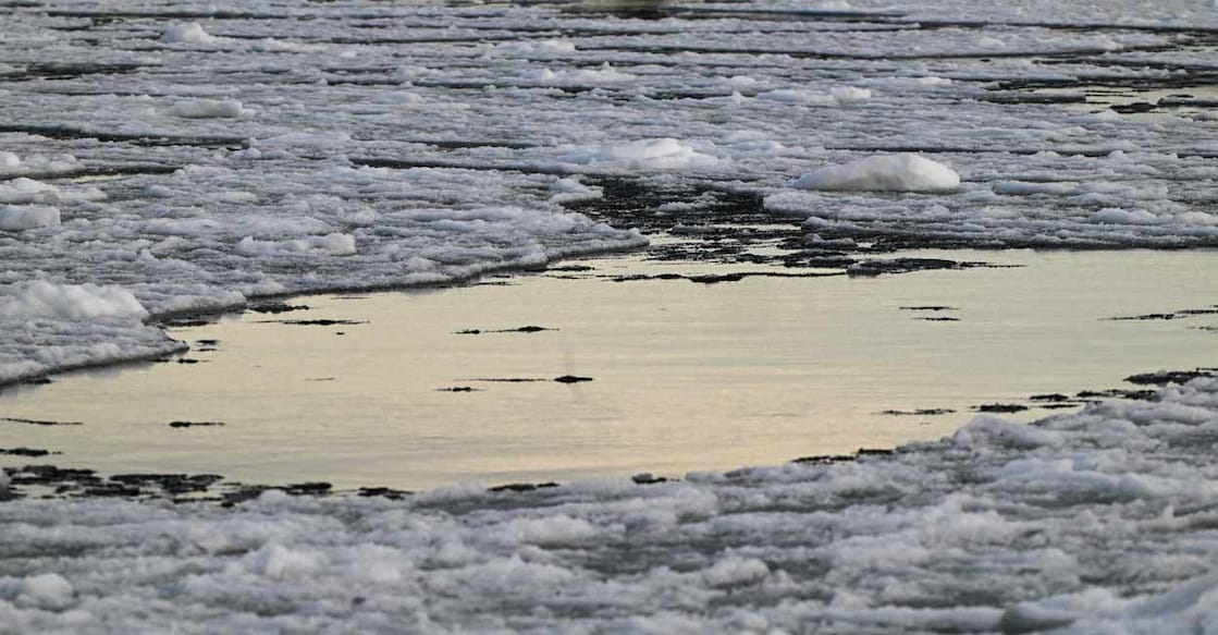 Drifting broken sea ice, floats out at sea, off the extreme western point of Replot Island, in the Baltic Sea. Due to a mild winter and temperatures above zero degrees centigrade, the open sea has not frozen. Photo: Olivier MORIN/AFP