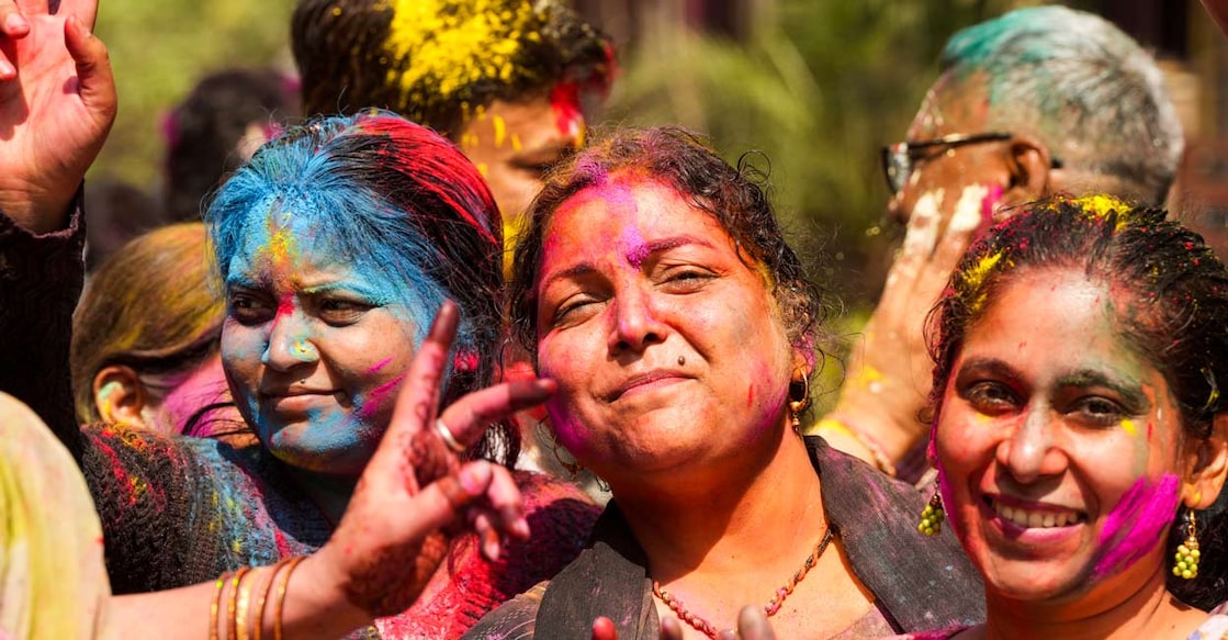 Women pose for pictures while celebrating Holi, in Ghaziabad. Photo: Atul Yadav/PTI Photo