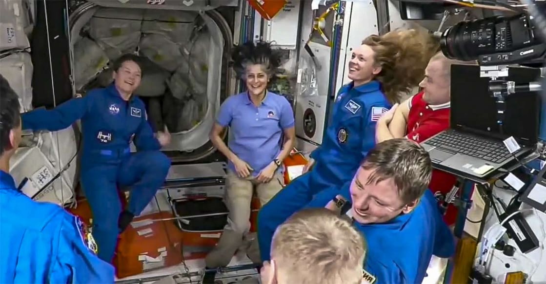 In this screenshot from a NASA video shows Suni Williams and other astronauts greeting each other after the SpaceX capsule docked with the International Space Station, Sunday. Photo: NASA via PTI