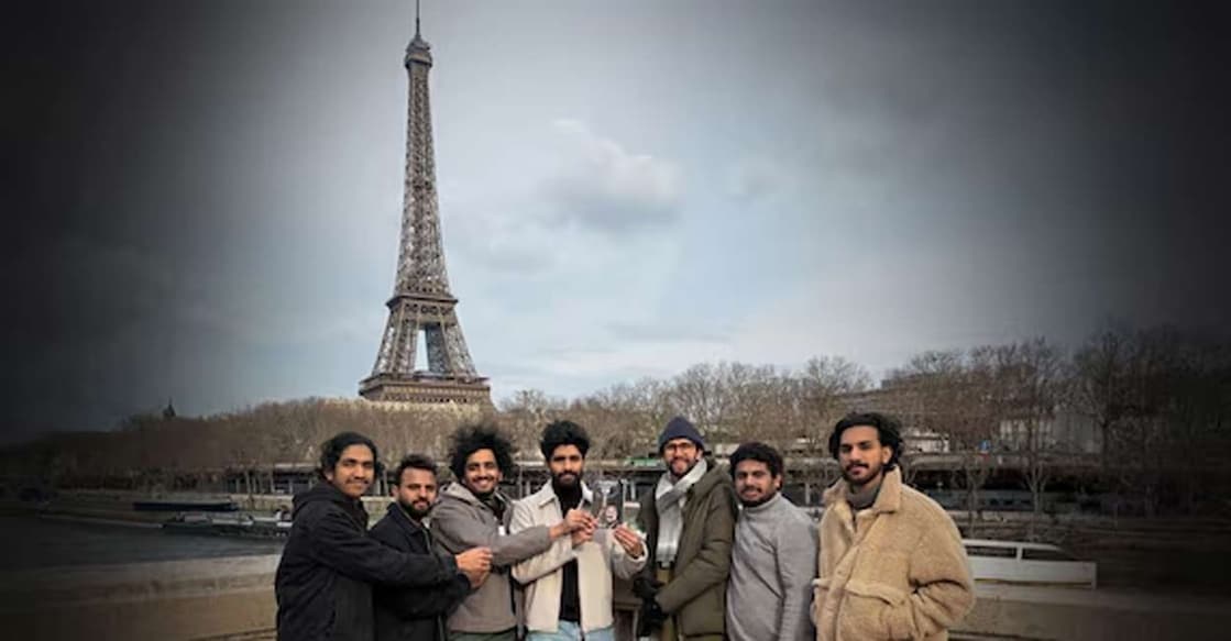 The travelogue 'Bonjour Paris', written by Kamal Varadoor, is being launched in front of the Eiffel Tower. Photo: Special arrangement