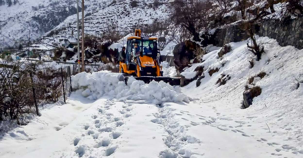 Snow being cleared from a road, in Uttarkashi district of Uttarakhand, Sunday. Photo: PTI