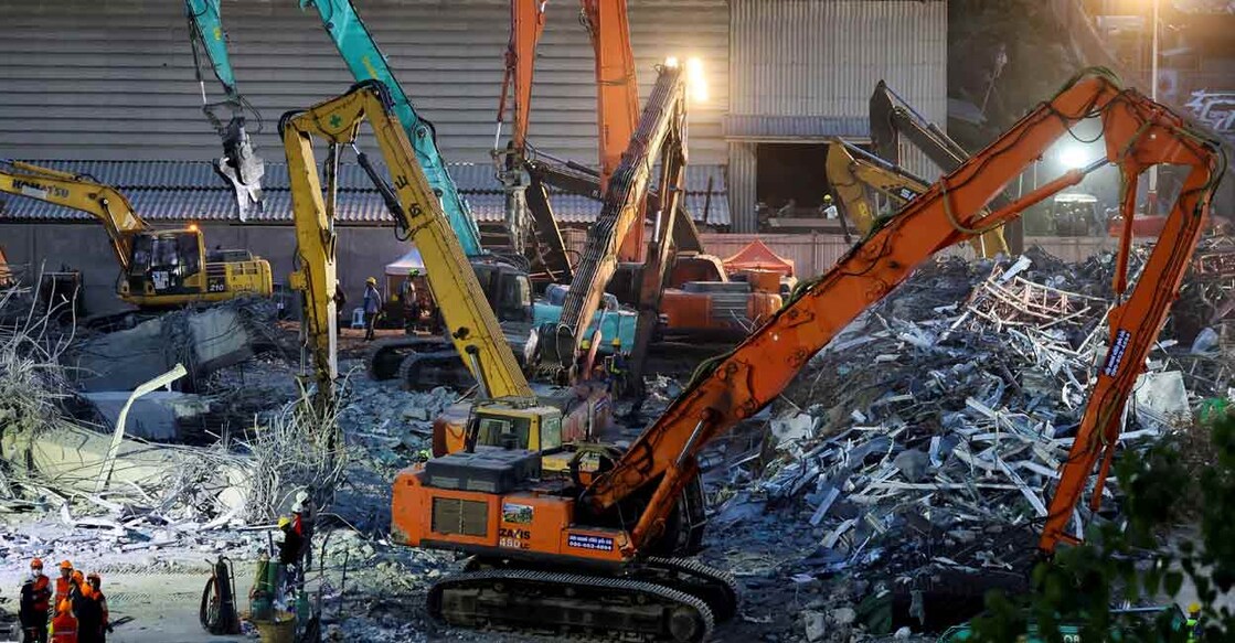 Heavy machinery operate at the site of a building that collapsed, following a strong earthquake, in Bangkok on Friday. Photo: Reuters/Athit Perawongmetha