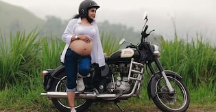 Riding bullet with baby bump: The poignant story beneath Athira's maternity photoshoot