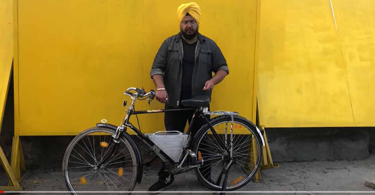 Gursaurabh Singh with a converted electric cycle.