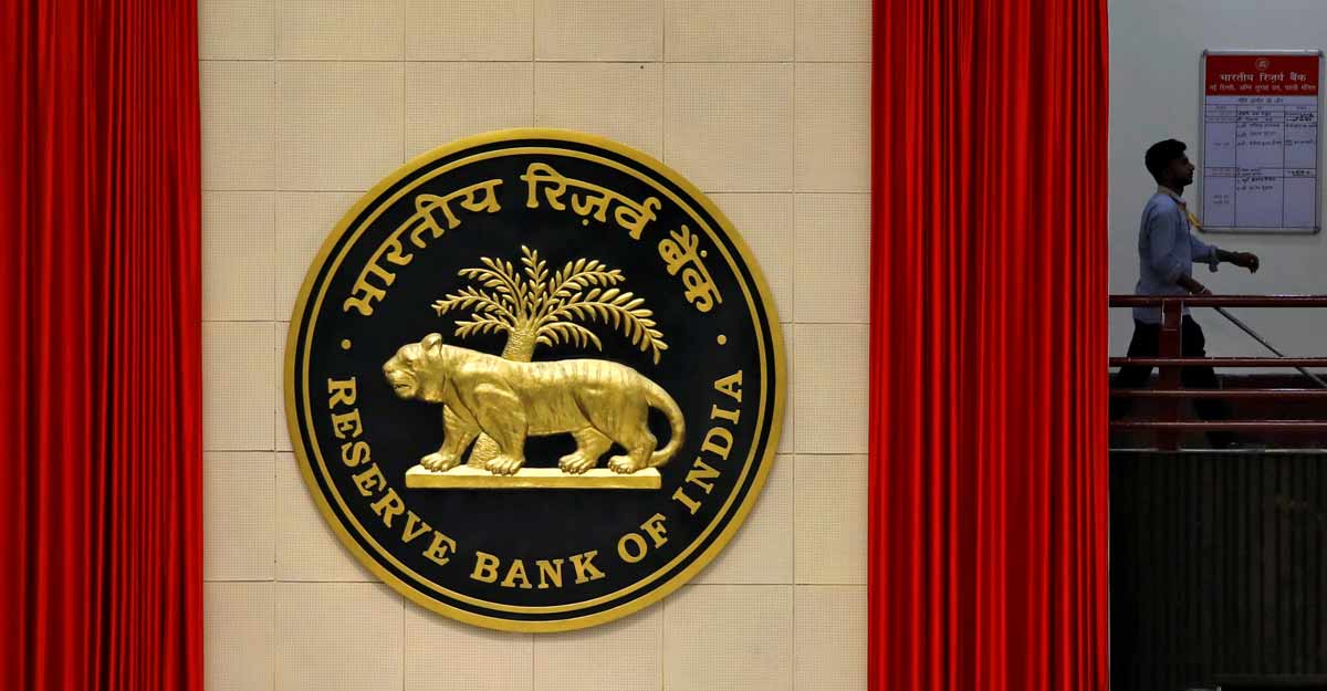 A worker walks past the logo of Reserve Bank of India (RBI) inside its office in New Delhi, India July 8, 2019. File photo: REUTERS/Anushree Fadnavis