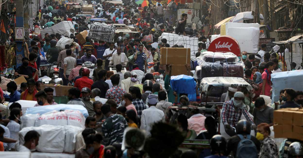 People walk at a crowded market in the old quarters of Delhi. REUTERS/Anushree Fadnavis