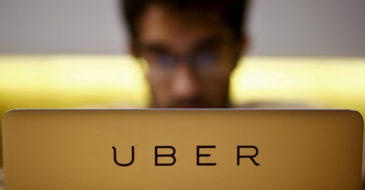 An employee works inside the office of US online cab-hailing company Uber, on the outskirts of New Delhi on April 24, 2015. Photo: Reuters/Anindito Mukherjee/File