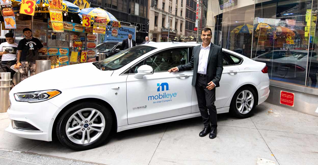 Mobileye’s CEO Amnon Shashua poses with a Mobileye driverless vehicle at the Nasdaq Market site in New York, U.S., July 20, 2021. File Photo: Reuters/Jeenah Moon