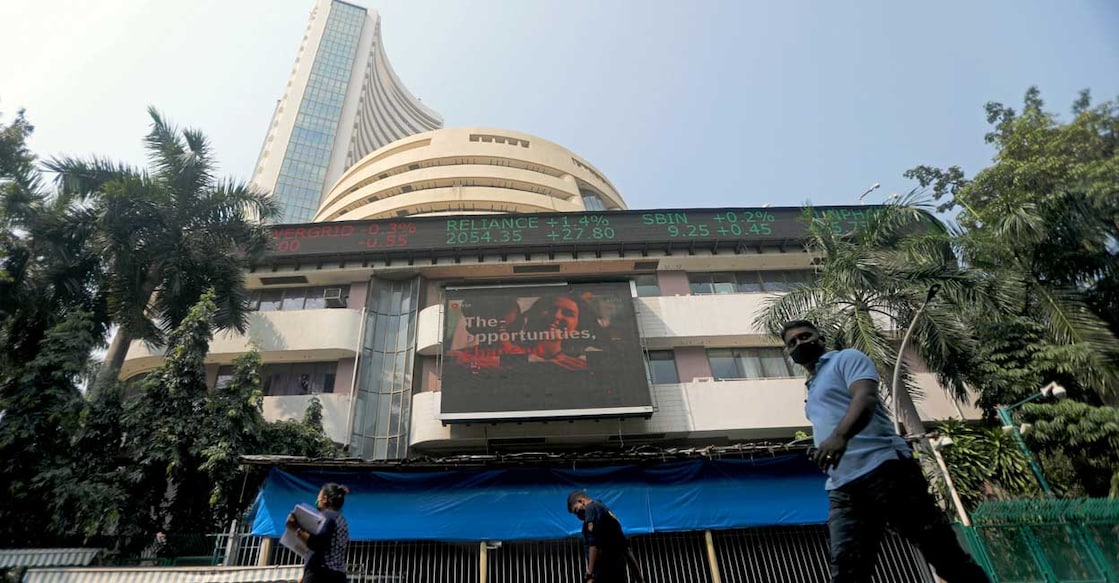 FILE PHOTO: People walk past the Bombay Stock Exchange (BSE) building in Mumbai, India, November 4, 2020. REUTERS/Francis Mascarenhas/File photo