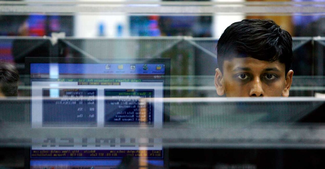A trader looks at a screen at a stock brokerage firm in Mumbai March 13, 2008. Reuters/Arko Datta/Files