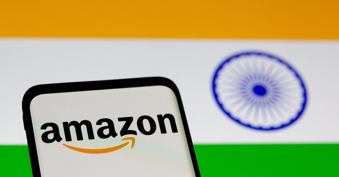 Smartphone with Amazon logo is seen in front of displayed Indian flag in this illustration taken, July 30, 2021. Reuters/Dado Ruvic/Illustration