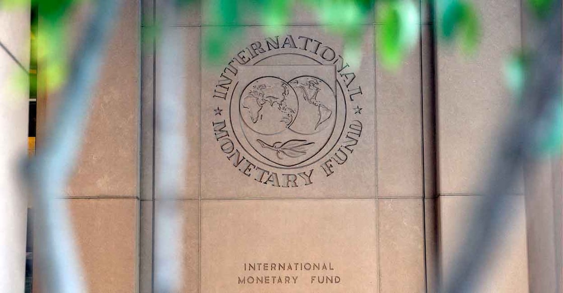 The International Monetary Fund (IMF) logo is displayed outside its headquarters in Washington, DC, on October 8, 2022. The IMF will be hosting its annual Fall Meetings in Washington DC from October 10 through October 16. Photo: Stefani Reynolds / AFP