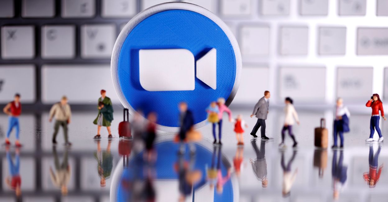 A 3D printed Zoom logo is placed between small toy people figures and a keyboard in this illustration taken April 12, 2020. Photo: Reuters/Dado Ruvic/Illustration